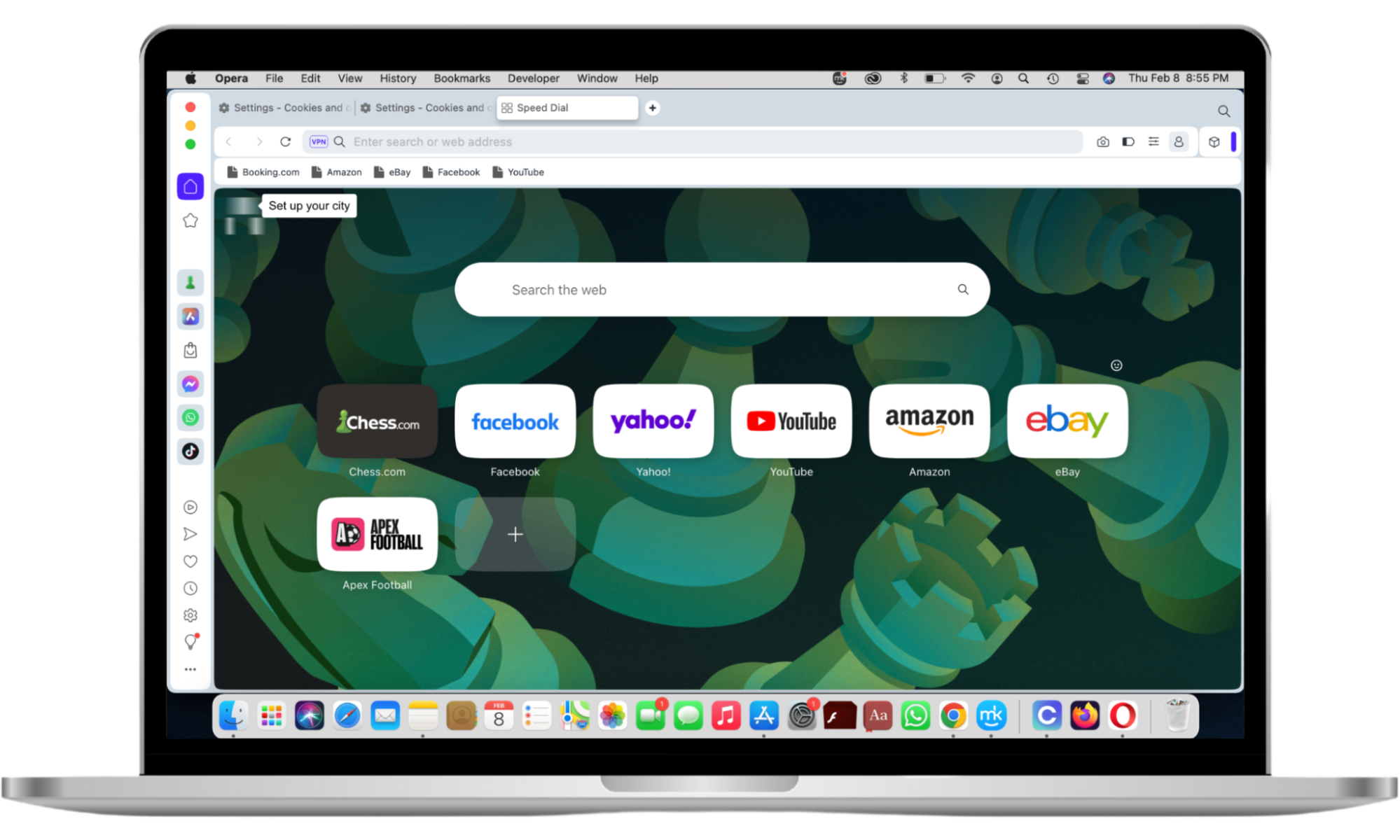 The Opera browser is opened on a MacBook Pro screen. The signature green, chess-themed background is featured, along with quick-access options and a sidebar. The Opera browser is opened on a MacBook Pro screen. The signature green, chess-themed background is featured, along with quick-access options and a sidebar.
