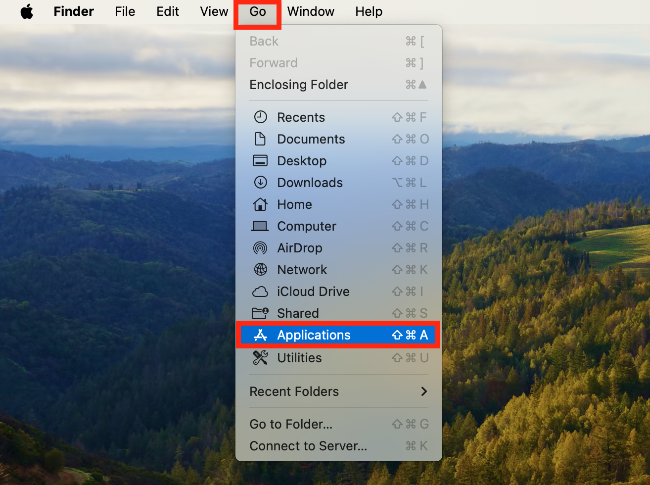 A screenshot of the Go drop-down menu showing how to access the Applications window to remove malware from Mac. A screenshot of the Go drop-down menu showing how to access the Applications window to remove malware from Mac.