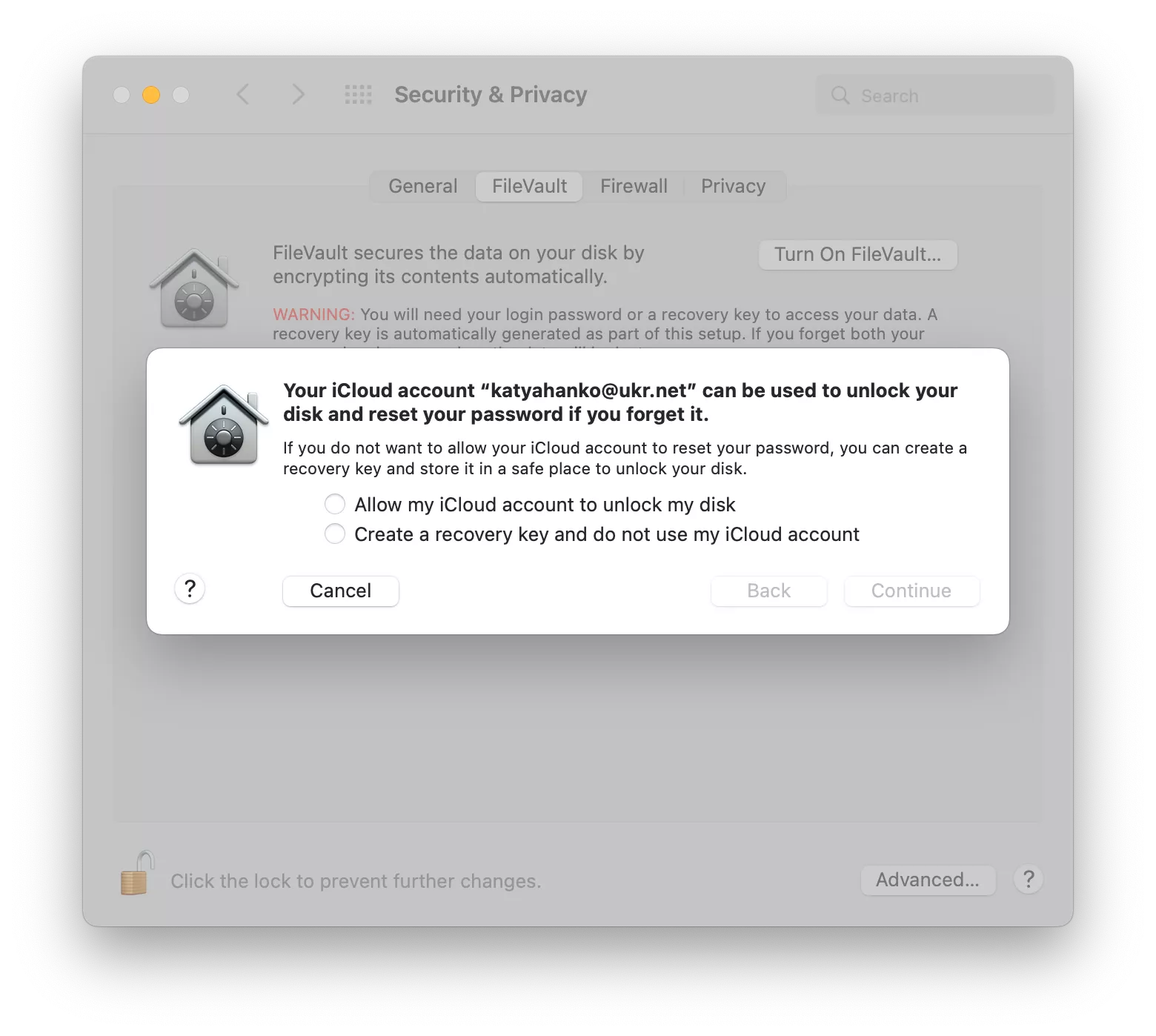 FileVault shows the options for unlocking your encrypted disk. Select the option you prefer, then click Continue.