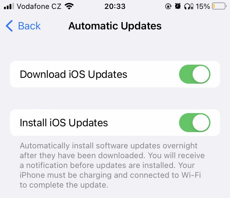 iPhone screen showing the Automatic Updates menu with the iPhone screen showing the Automatic Updates menu with the