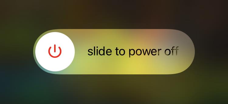 A black iPhone screen with a power toggle that is toggled to A black iPhone screen with a power toggle that is toggled to