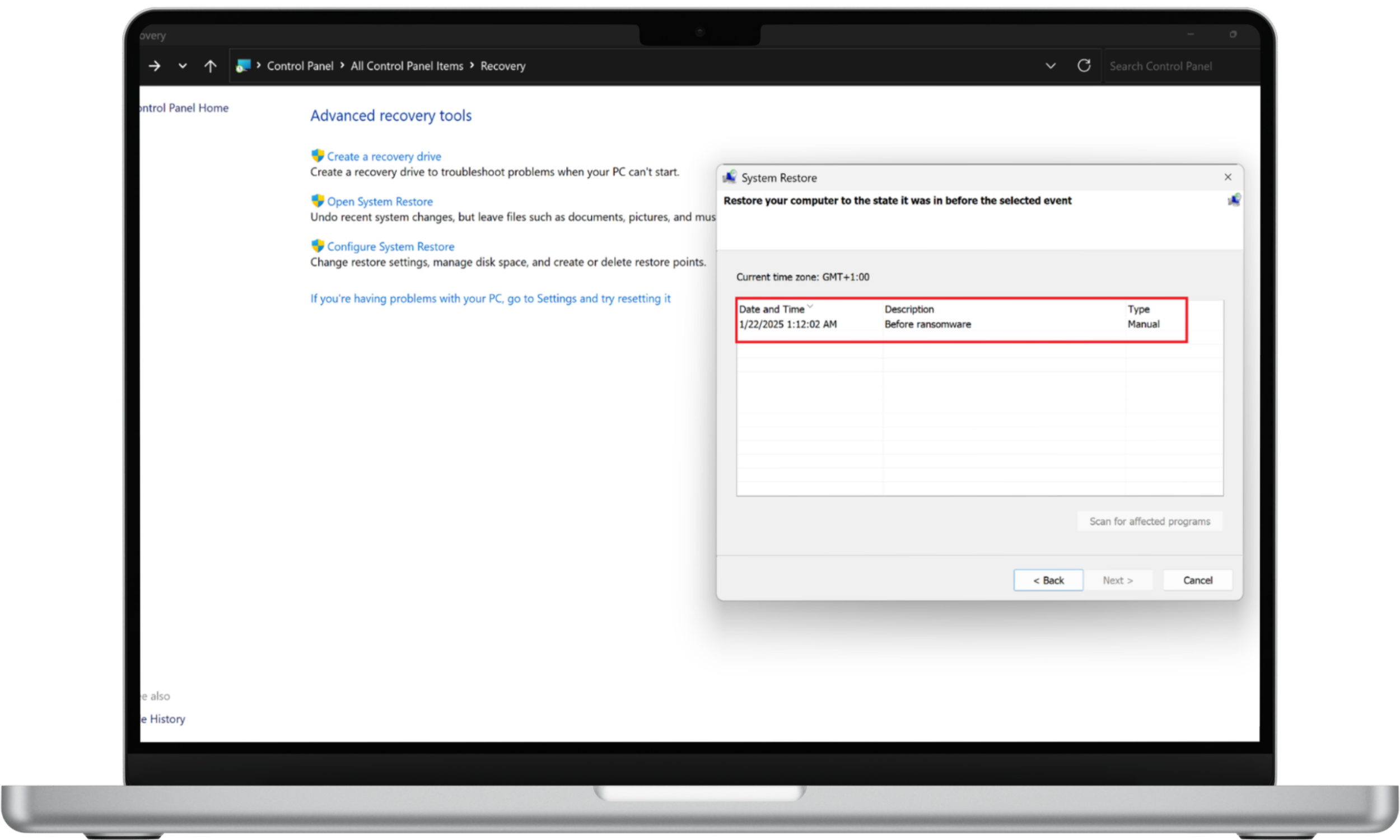 System Restore window on Windows 11 listing restore points, with a highlighted point labeled 'Before ransomware.