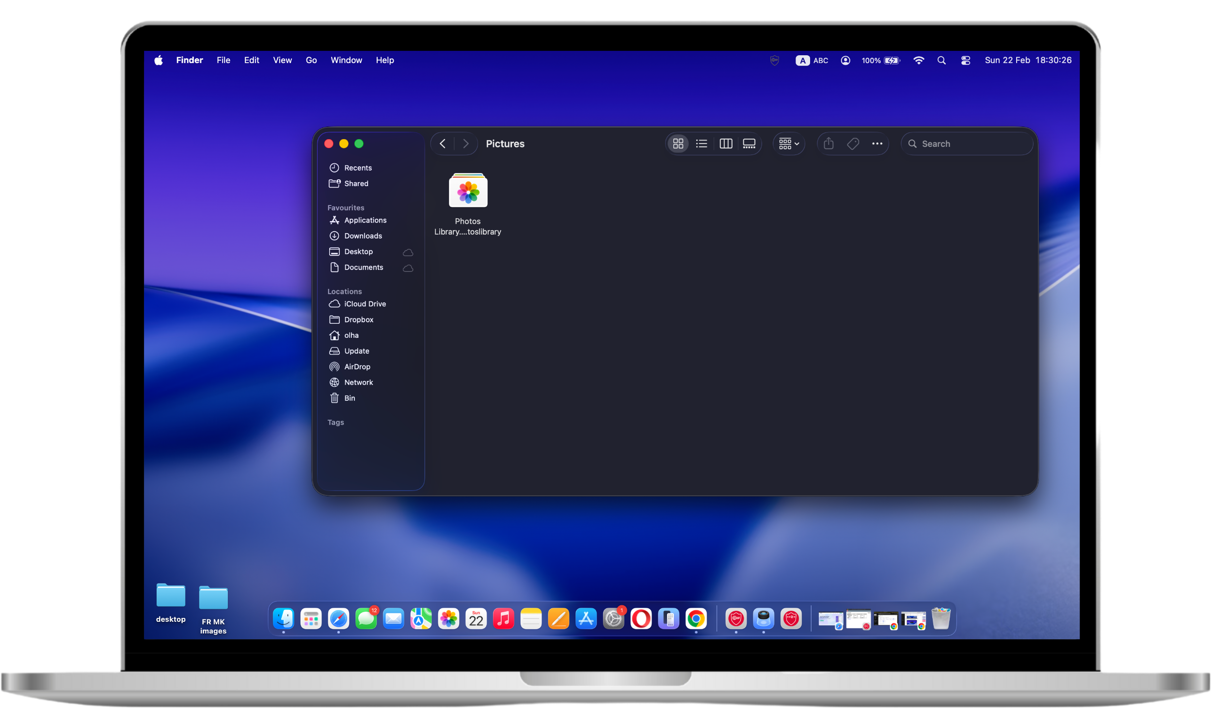 Mac Finder window showing the Photos Library folder selected inside the Pictures directory to review stored webcam images and videos.