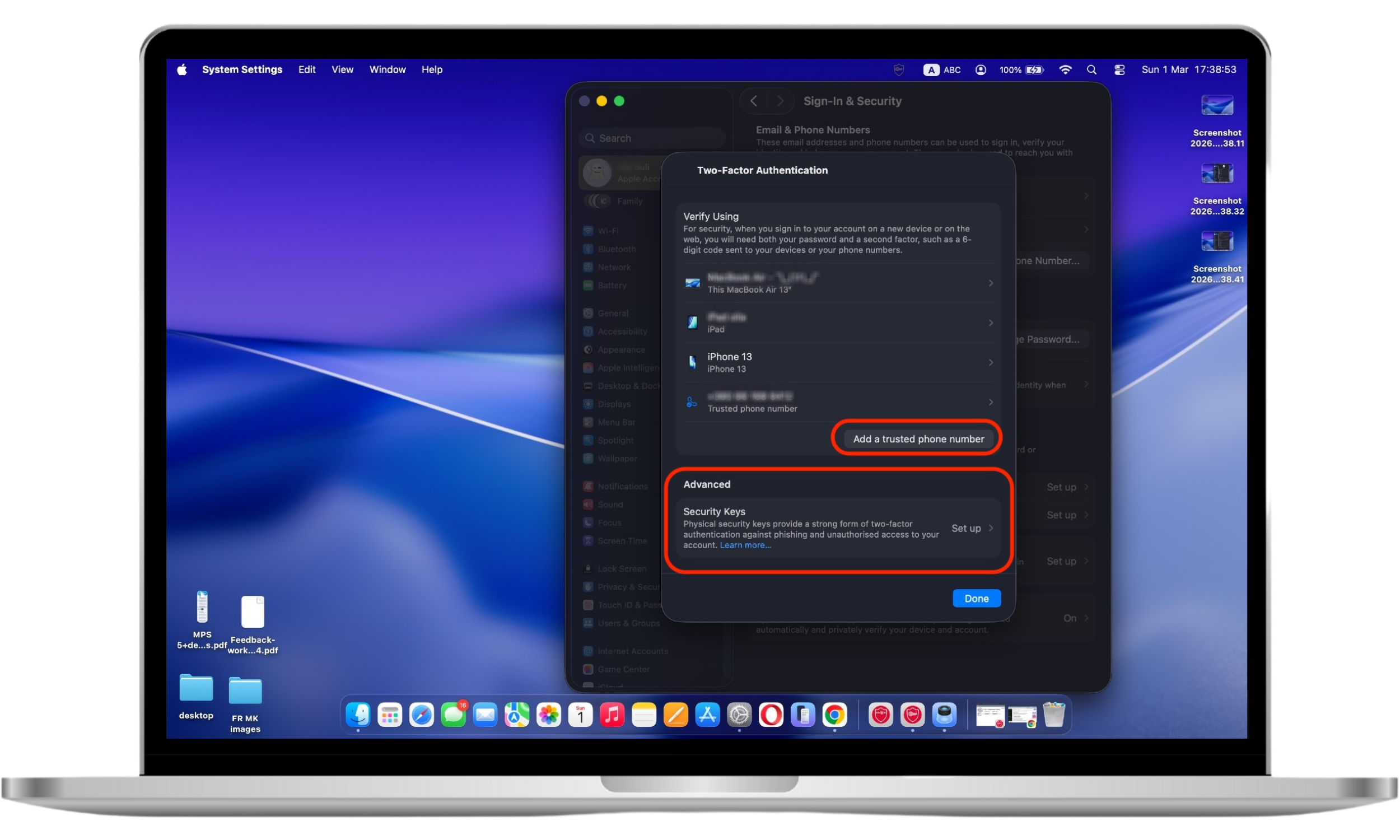 Adding a trusted phone number or security key in Apple ID two-factor authentication settings.