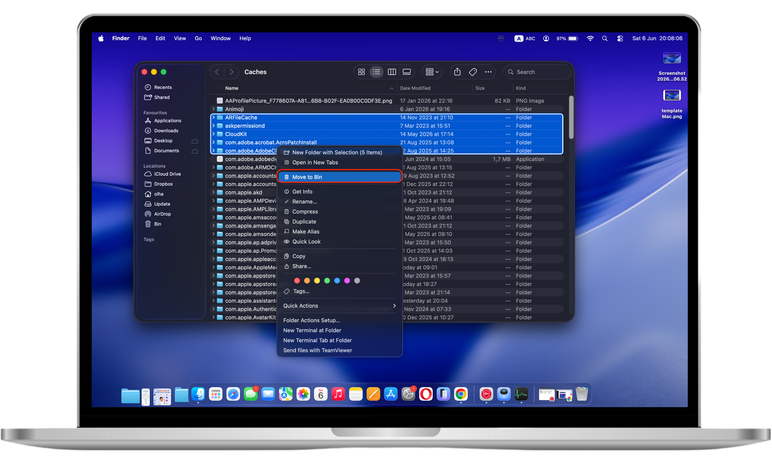 Files in the macOS Caches folder are selected in Finder with the Move to Trash option available, helping users remove temporary files and free up storage space.